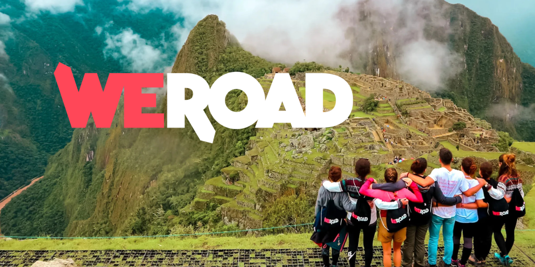 WeRoad travelers overlooking Machu Picchu